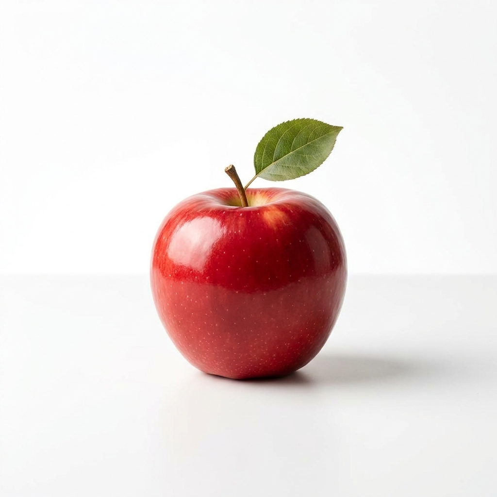 a red apple on a white table, studio lighting